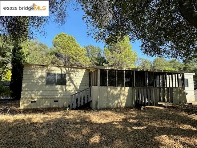 a view of a outdoor space with wooden fence