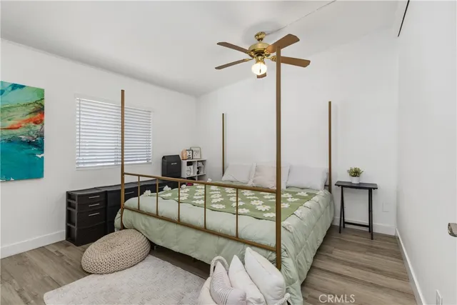 a bedroom with furniture and a window