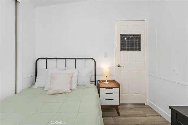 a bedroom with a bed and a table