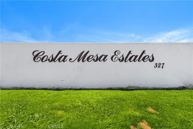 a view of outdoor space with garden and wooden fence