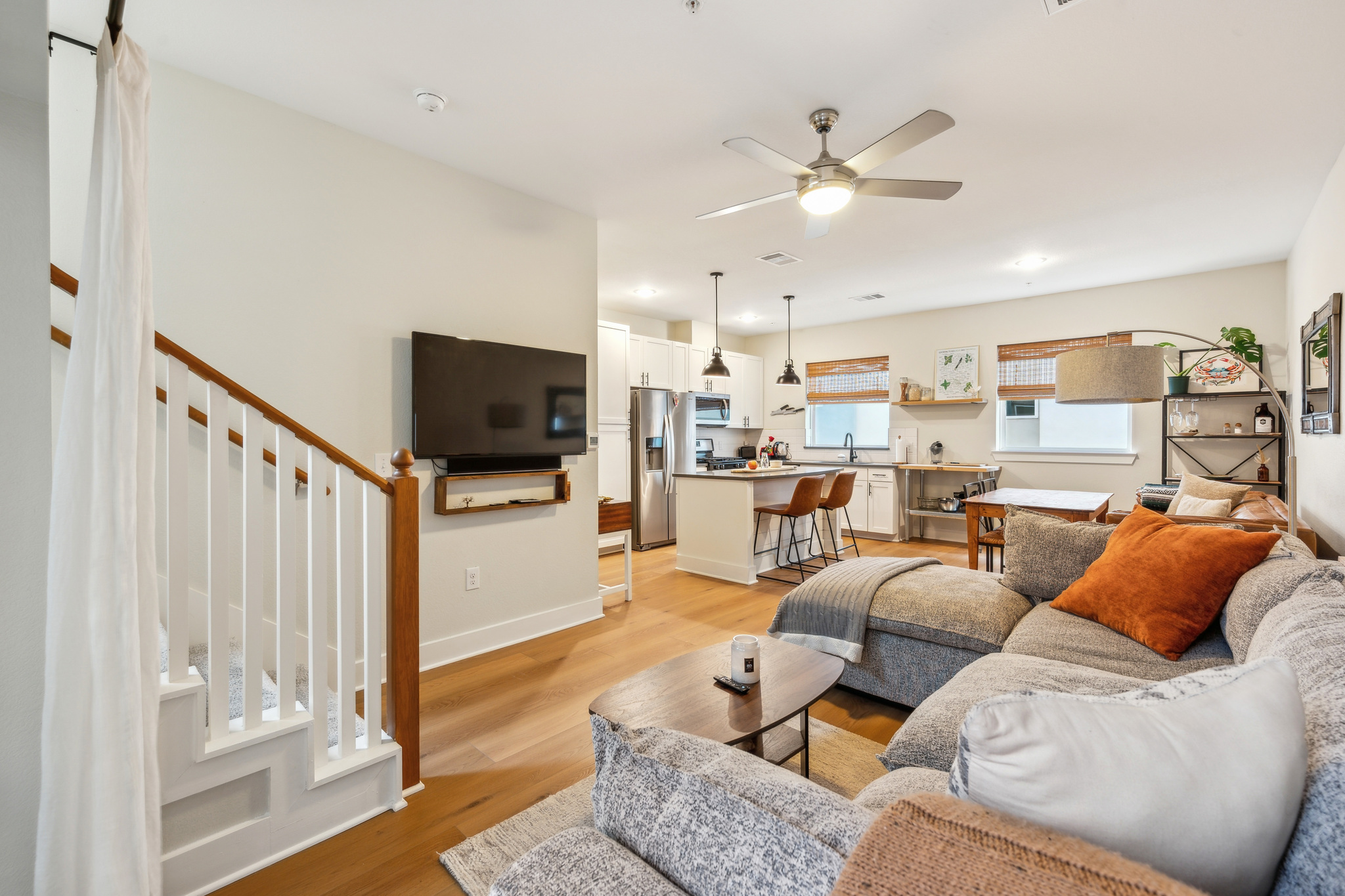 2827 Manor Road, Unit 3104 Austin, TX 78722 - Photo 8 of 30 Hardwood floors flow through this sun-filled living area and open kitchen, ideal for entertaining.