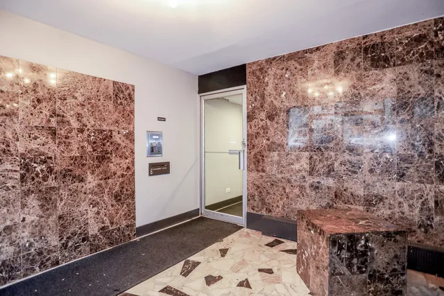 a bathroom with a shower and a toilet