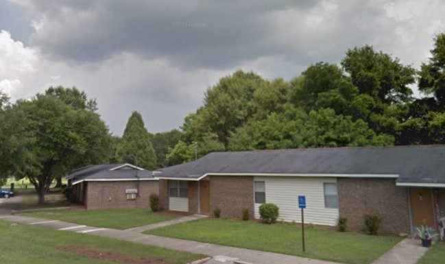 123 Lee Road Other, AL 36832 - Photo 4 of 6 a front view of a house with garden