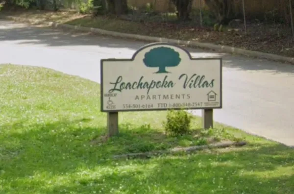 a sign broad on the side of the road