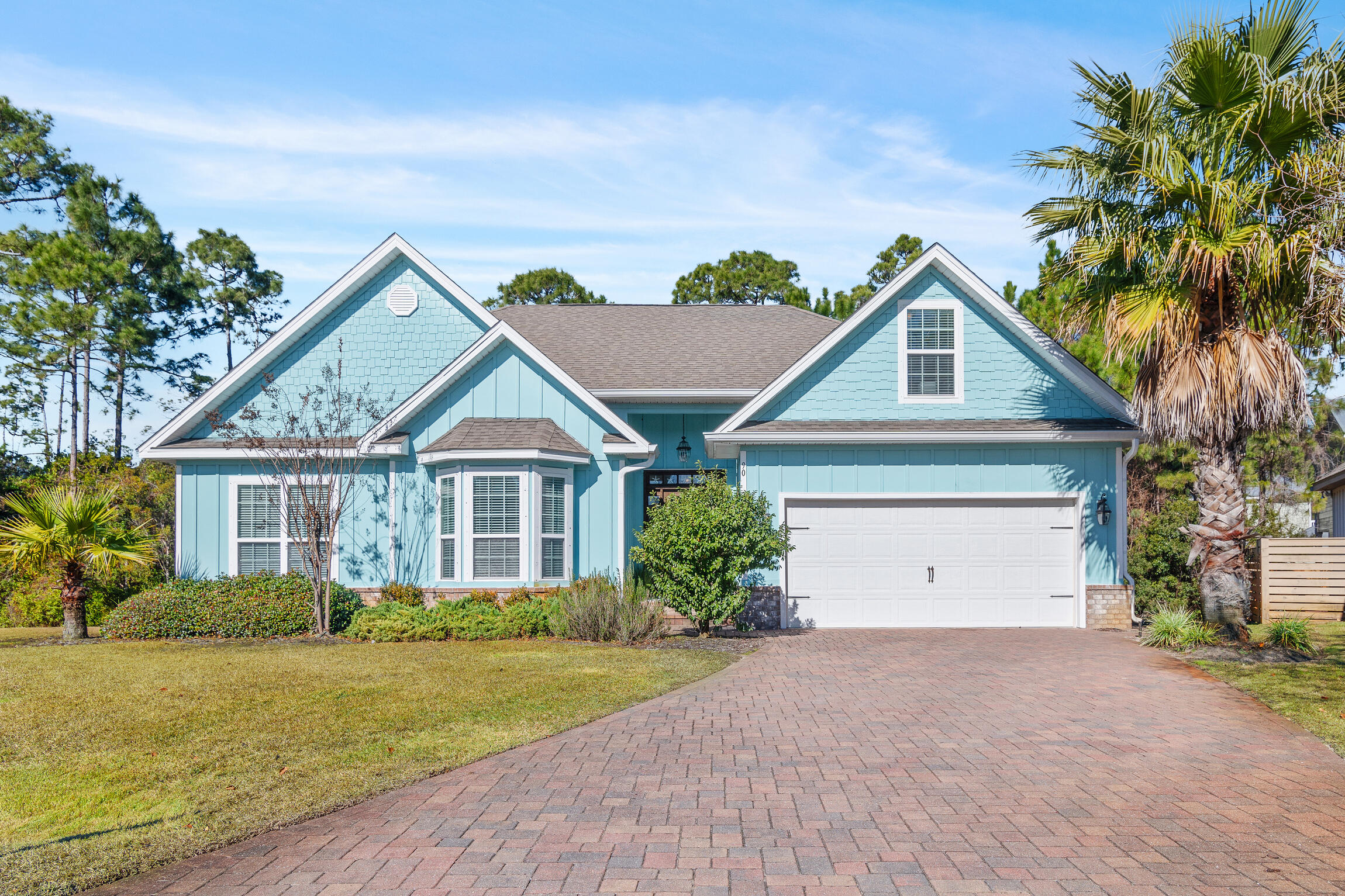 90 Ocean Spray Circle Santa Rosa Beach, FL 32459 - Photo 1 of 57 a view of a house with a yard and palm trees