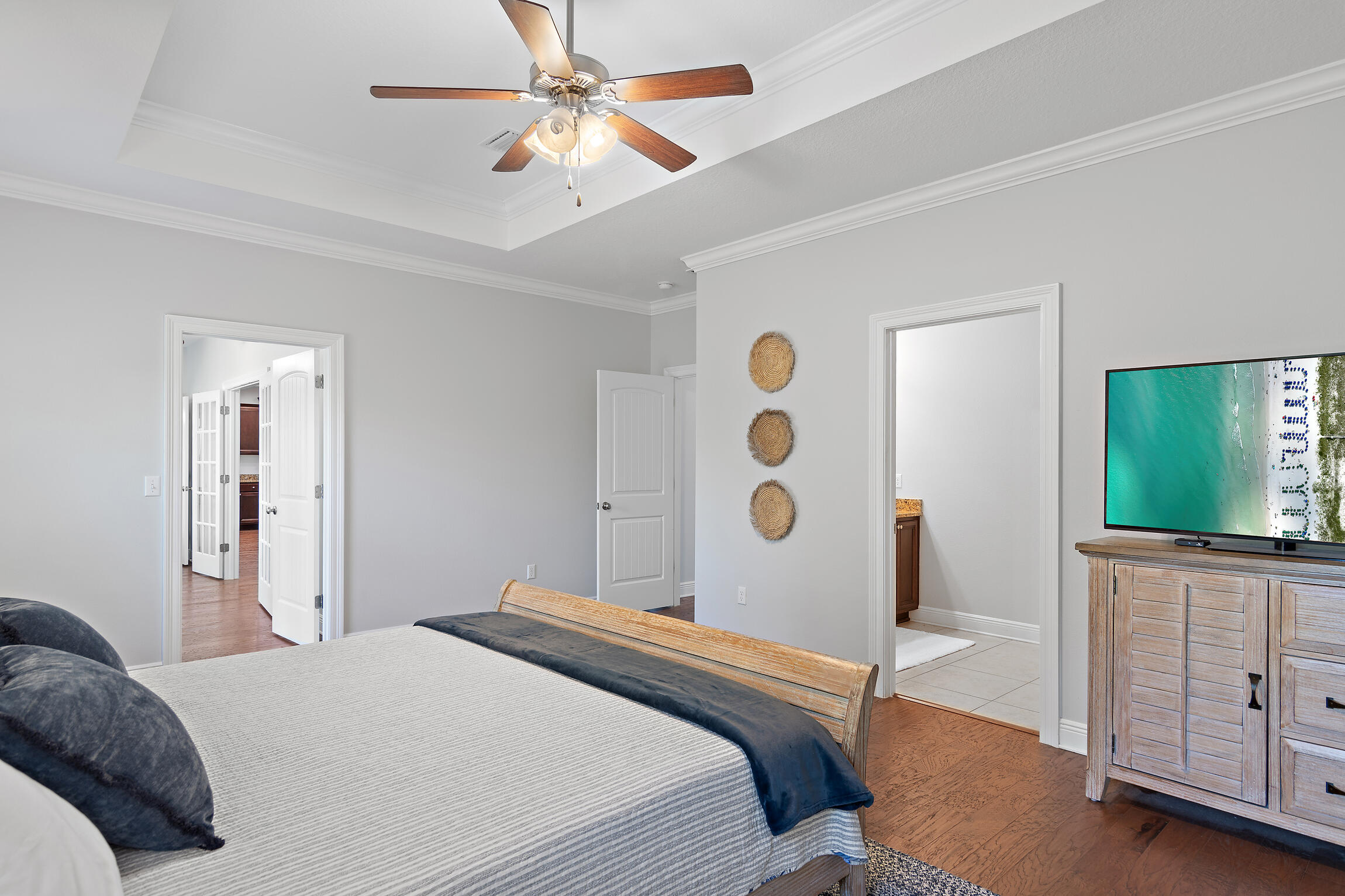 90 Ocean Spray Circle Santa Rosa Beach, FL 32459 - Photo 19 of 57 a bedroom with a bed and a flat screen tv