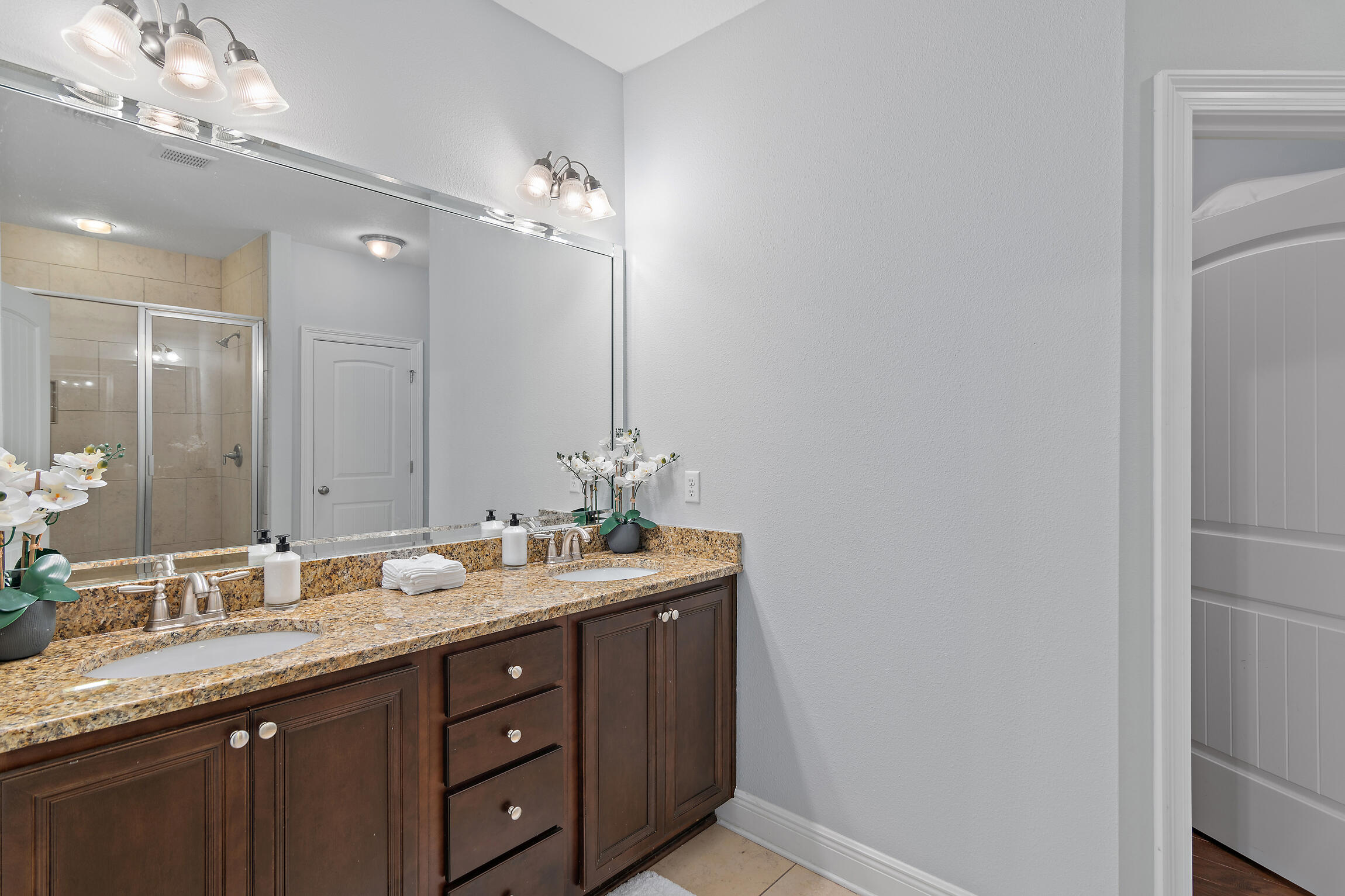90 Ocean Spray Circle Santa Rosa Beach, FL 32459 - Photo 20 of 57 a bathroom with a double vanity sink and a mirror