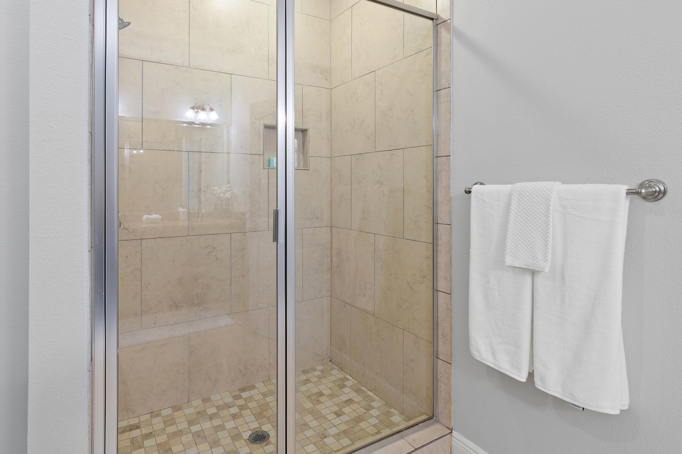 90 Ocean Spray Circle Santa Rosa Beach, FL 32459 - Photo 21 of 57 a bathroom with a glass shower door
