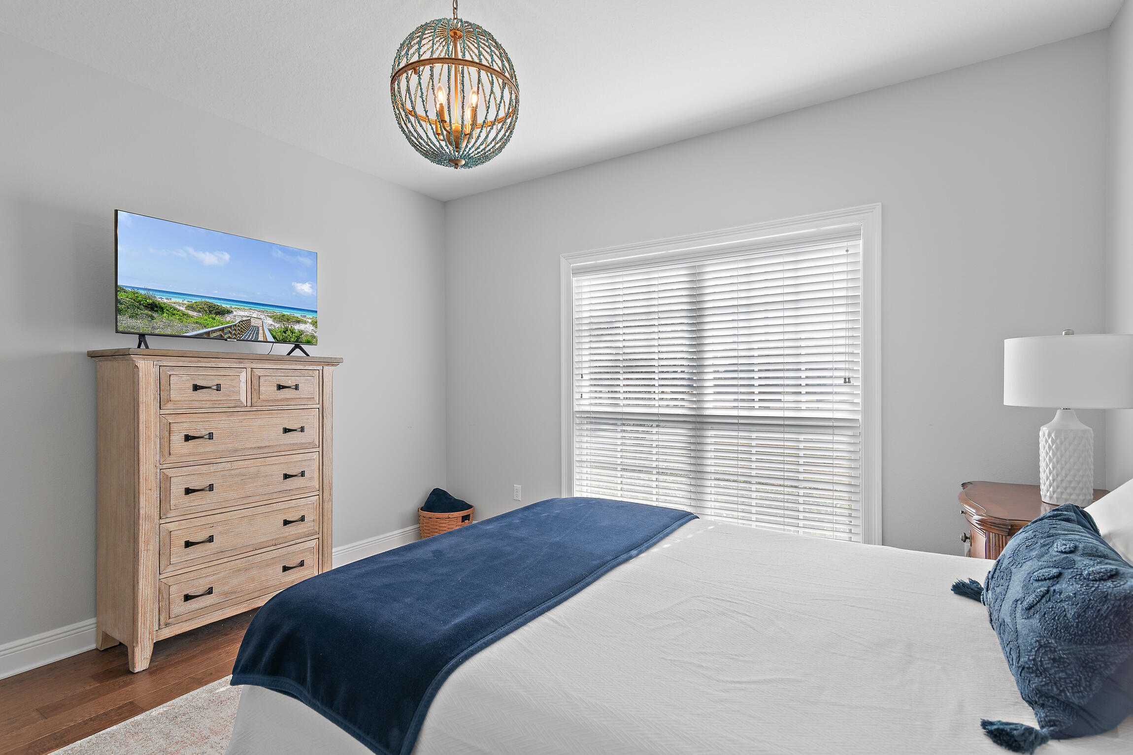 90 Ocean Spray Circle Santa Rosa Beach, FL 32459 - Photo 24 of 57 a bedroom with a bed a dresser and a window