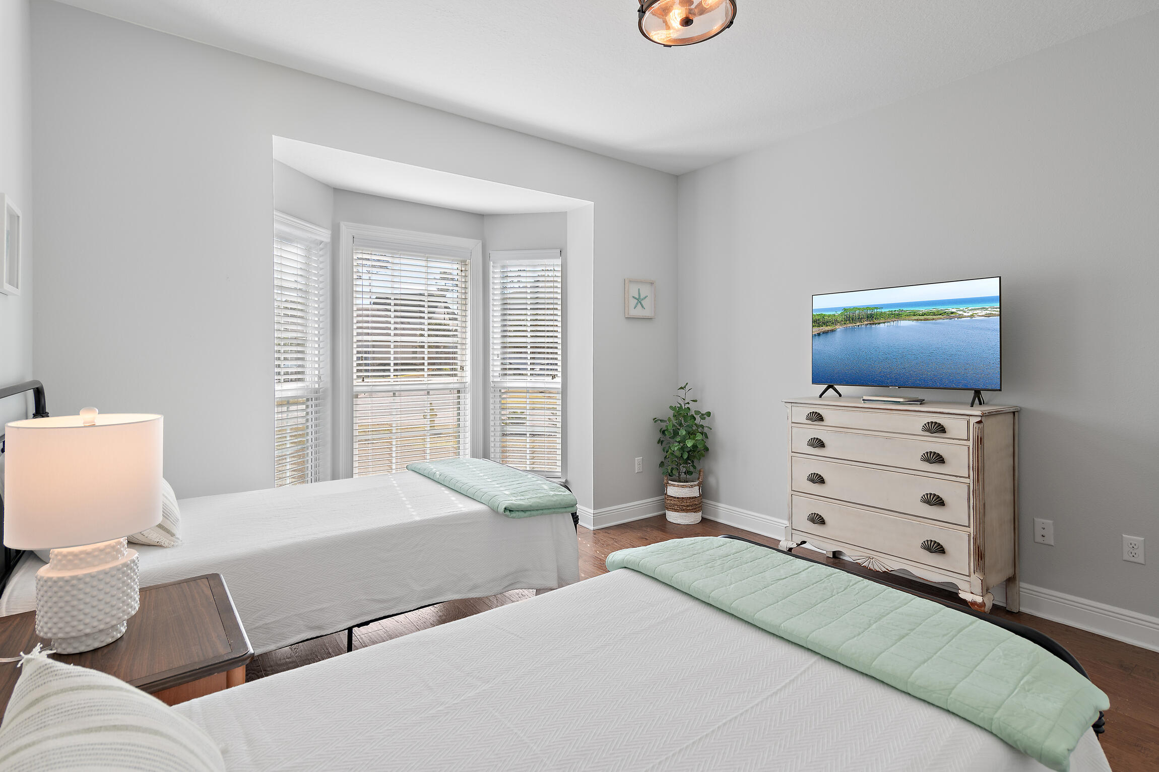 90 Ocean Spray Circle Santa Rosa Beach, FL 32459 - Photo 27 of 57 a bedroom with a bed and flat screen tv