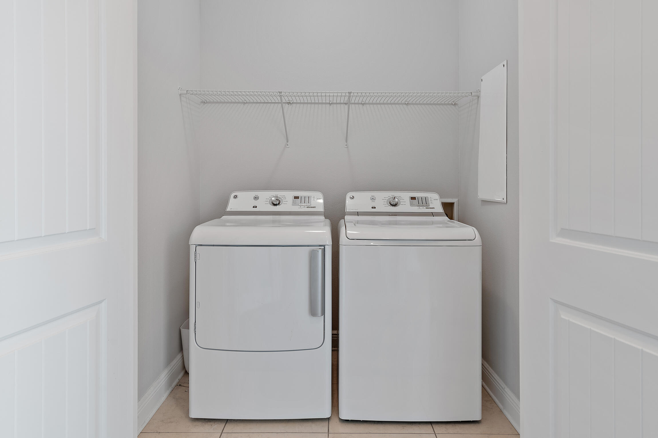 90 Ocean Spray Circle Santa Rosa Beach, FL 32459 - Photo 28 of 57 a utility room with dryer and washer