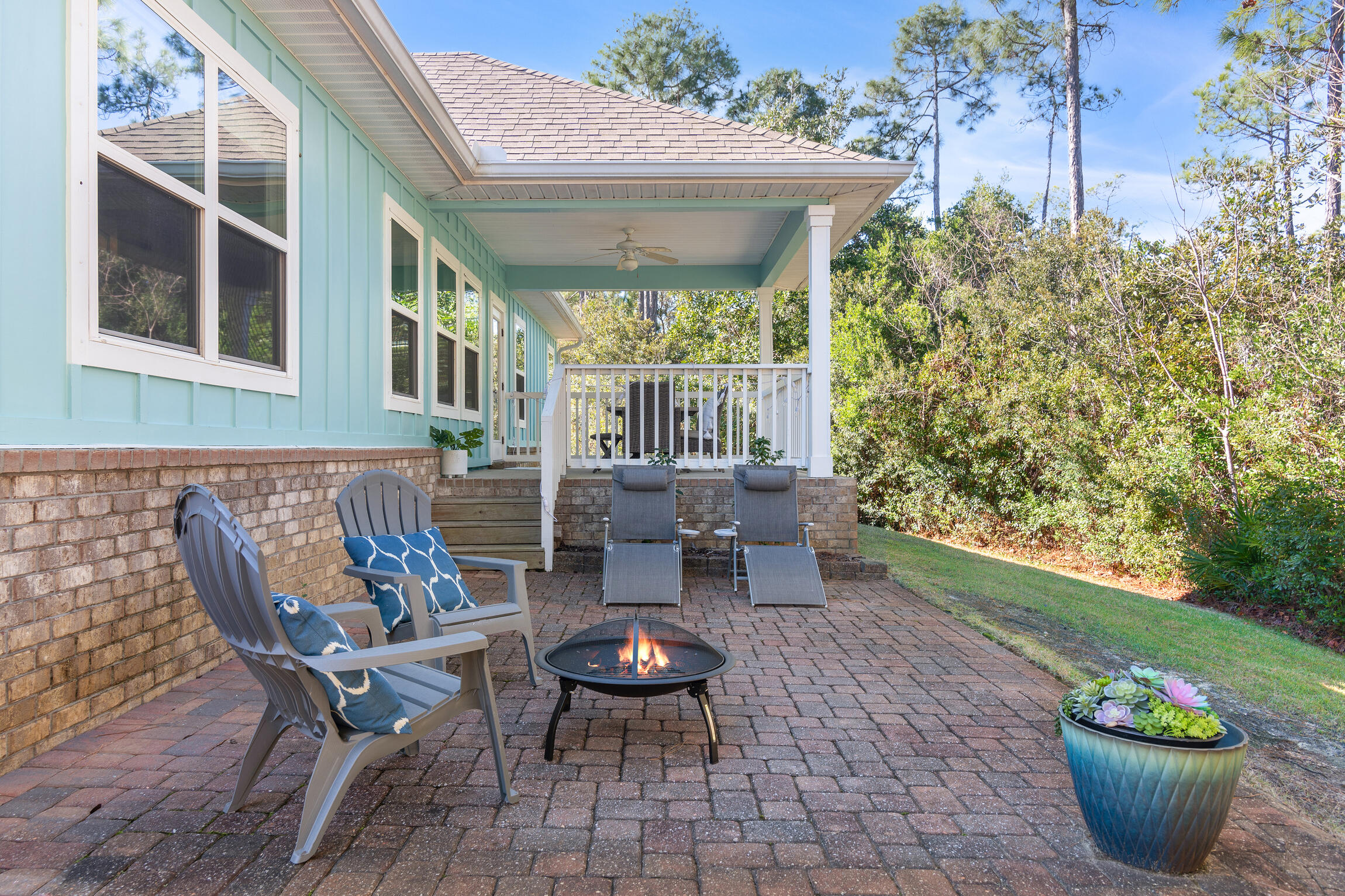 90 Ocean Spray Circle Santa Rosa Beach, FL 32459 - Photo 34 of 57 a view of a patio with couple of chairs and a fountain