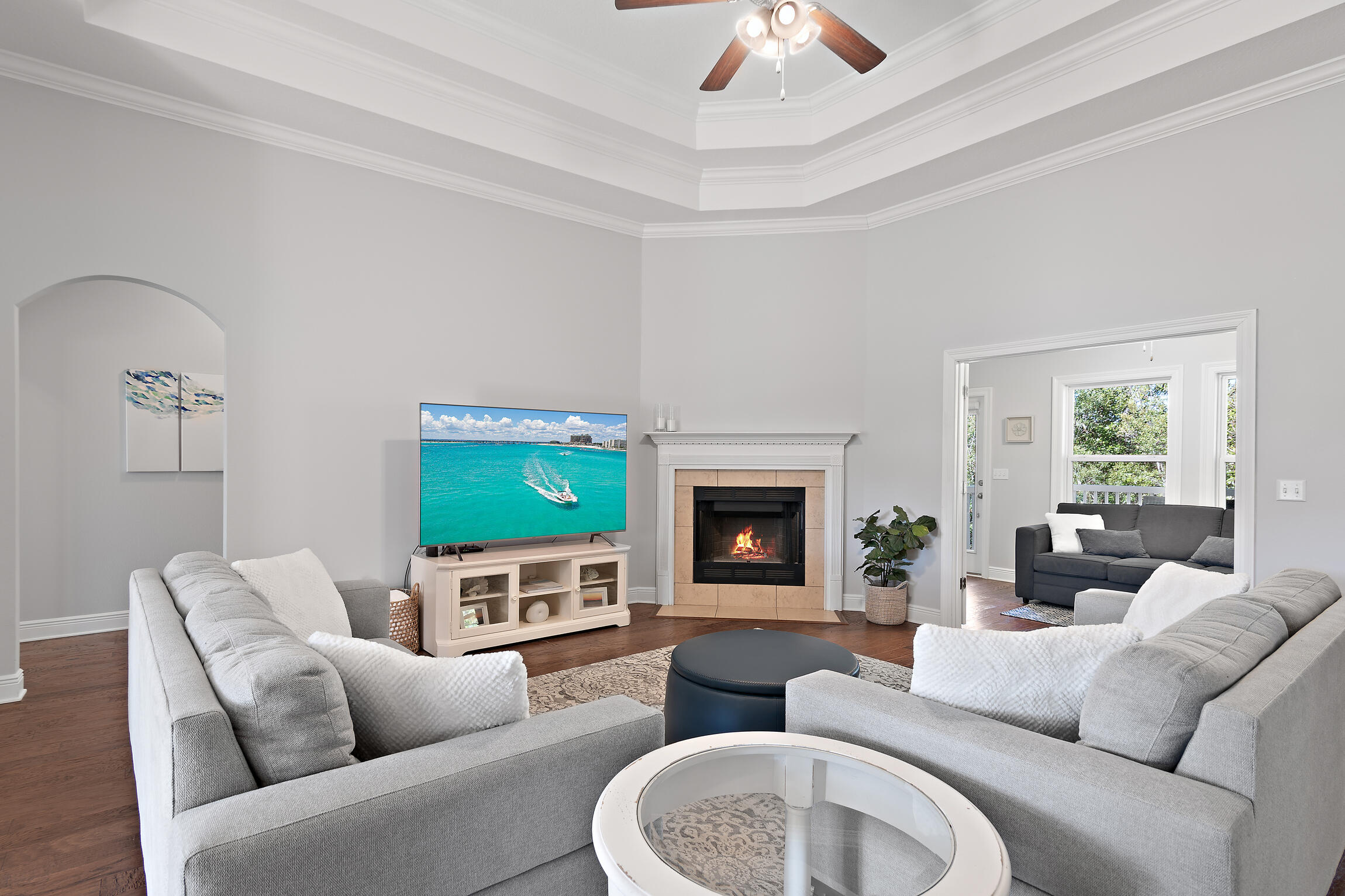 90 Ocean Spray Circle Santa Rosa Beach, FL 32459 - Photo 4 of 57 a living room with furniture fireplace and a flat screen tv