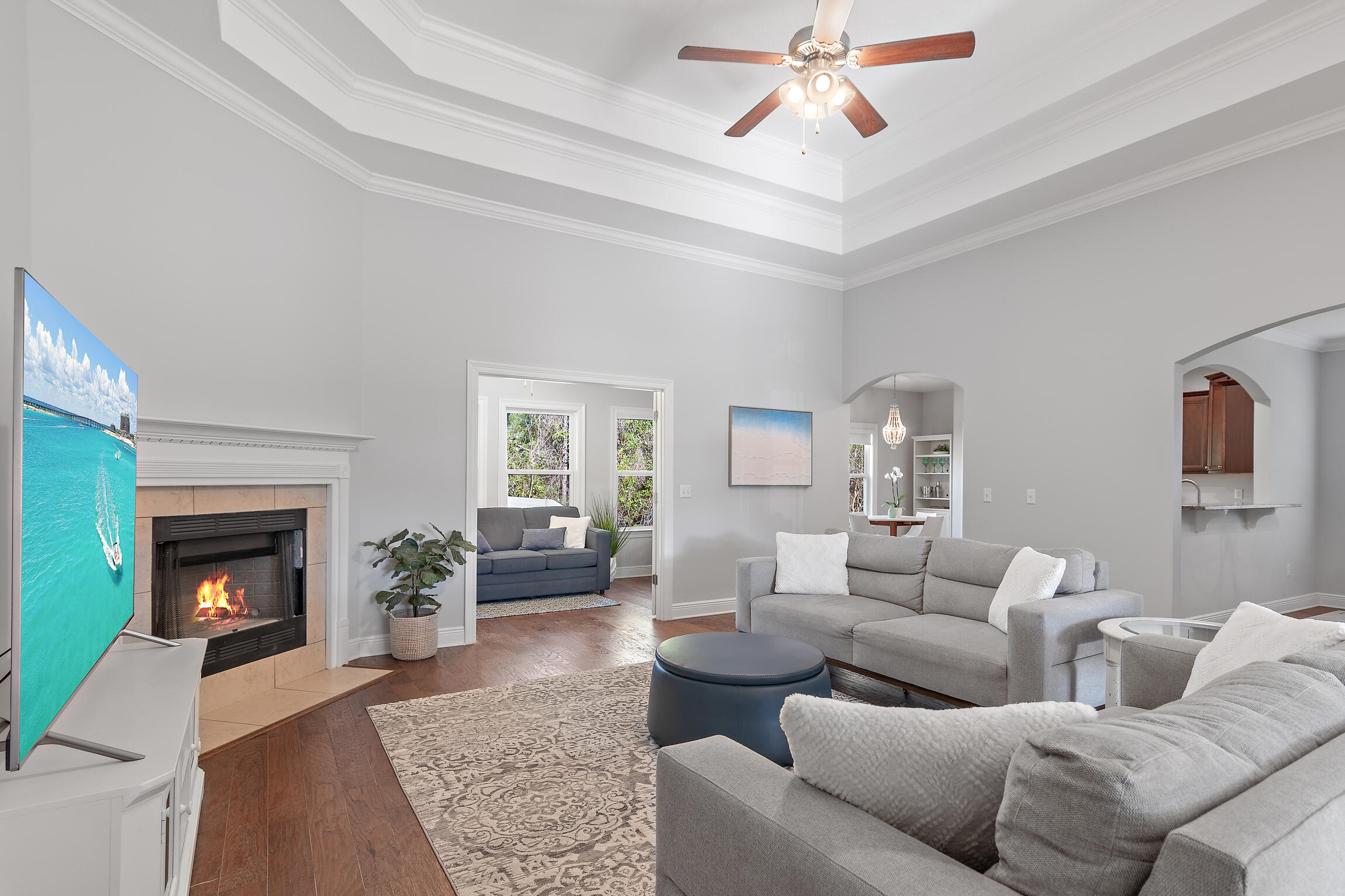 90 Ocean Spray Circle Santa Rosa Beach, FL 32459 - Photo 6 of 57 a living room with furniture a fireplace and a chandelier