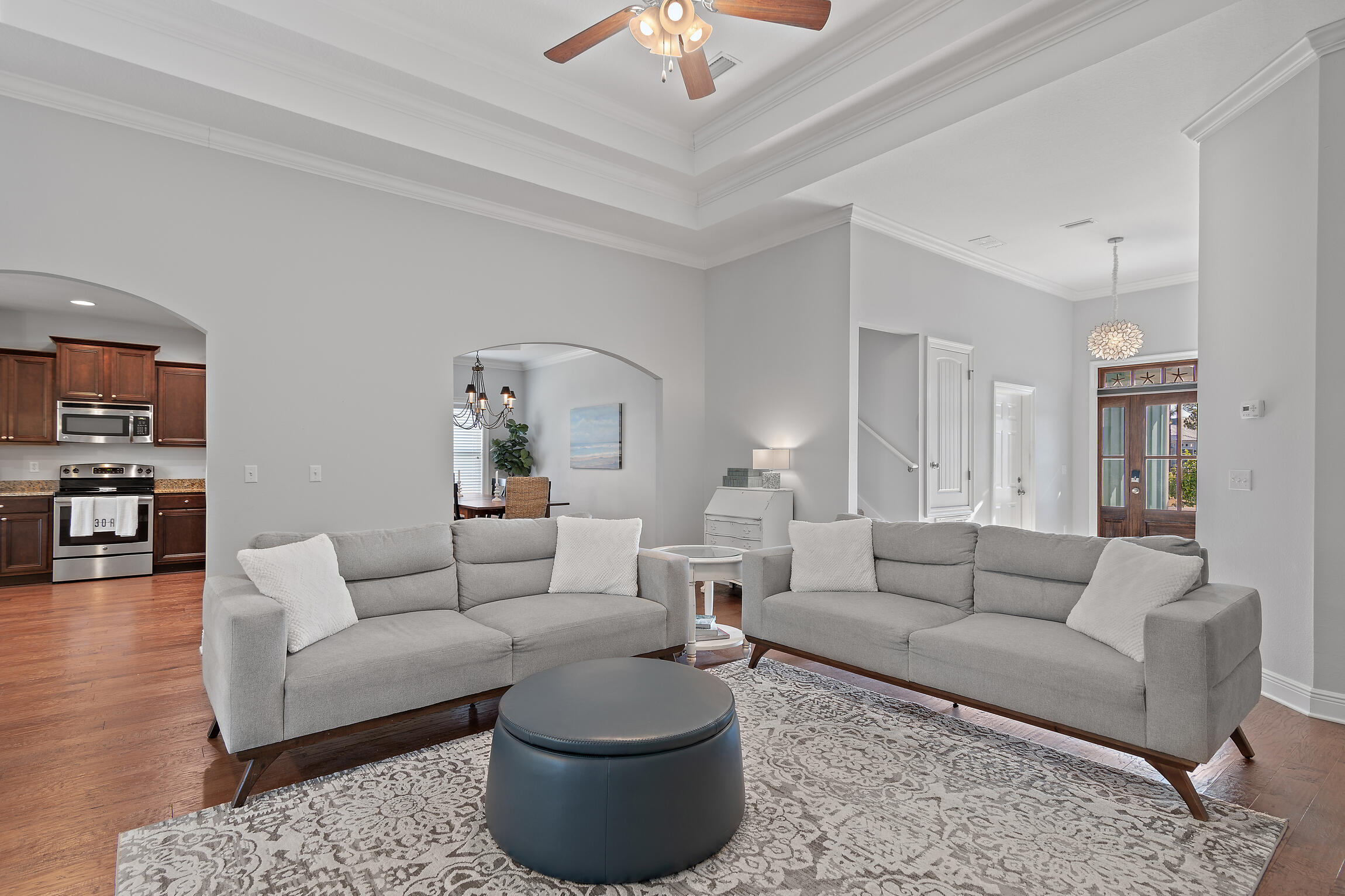 90 Ocean Spray Circle Santa Rosa Beach, FL 32459 - Photo 7 of 57 a living room with furniture a rug and a chandelier