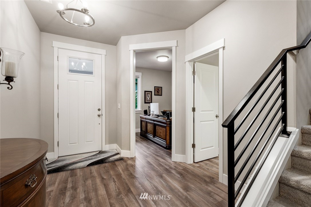3615 177th Street Southeast Bothell, WA 98012 - Photo 13 of 32 a view of a hallway view with wooden floor and staircase