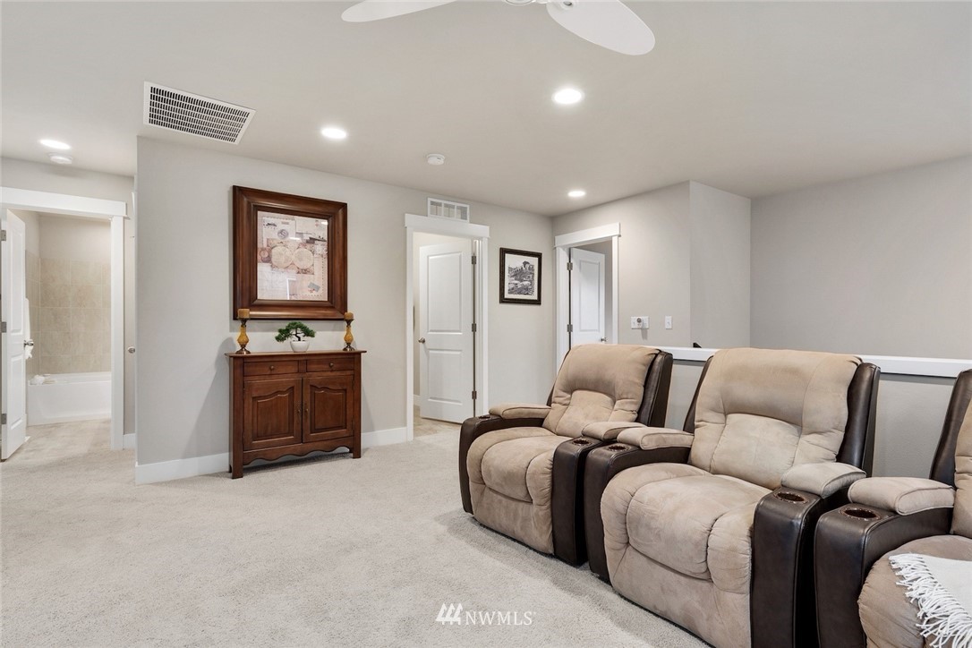 3615 177th Street Southeast Bothell, WA 98012 - Photo 15 of 32 a spacious bedroom with a bed and ceiling fan