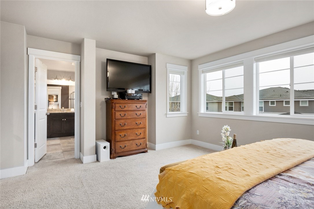 3615 177th Street Southeast Bothell, WA 98012 - Photo 17 of 32 a bedroom with a bed and a television