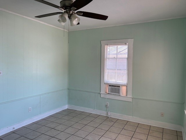 4725 Avenue R 1/2 Galveston, TX 77551 - Photo 5 of 18 a view of an empty room with window and chandelier fan