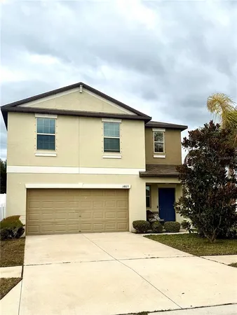 a front view of a house with yard