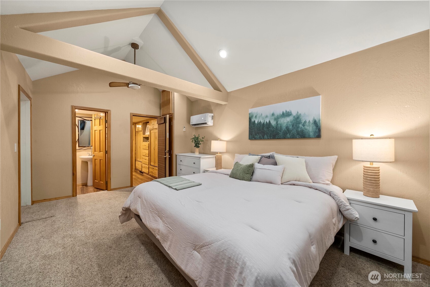 1546 Reservation Road Southeast, Unit 149 Olympia, WA 98513 - Photo 13 of 38 a spacious bedroom with a bed and a lamp