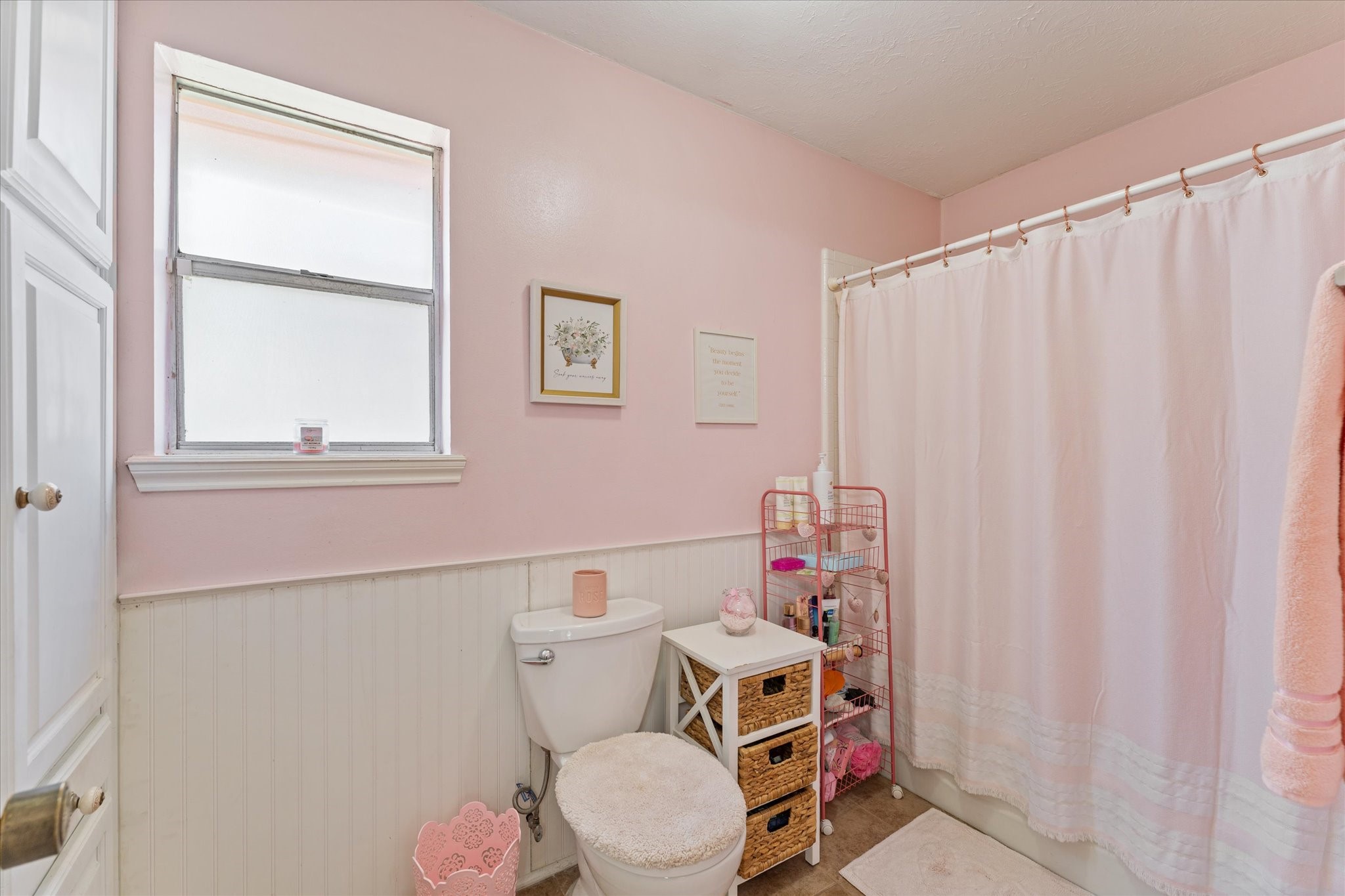 19527 Enchanted Spring Drive Spring, TX 77388 - Photo 15 of 33 a bathroom with a toilet and a shower curtain