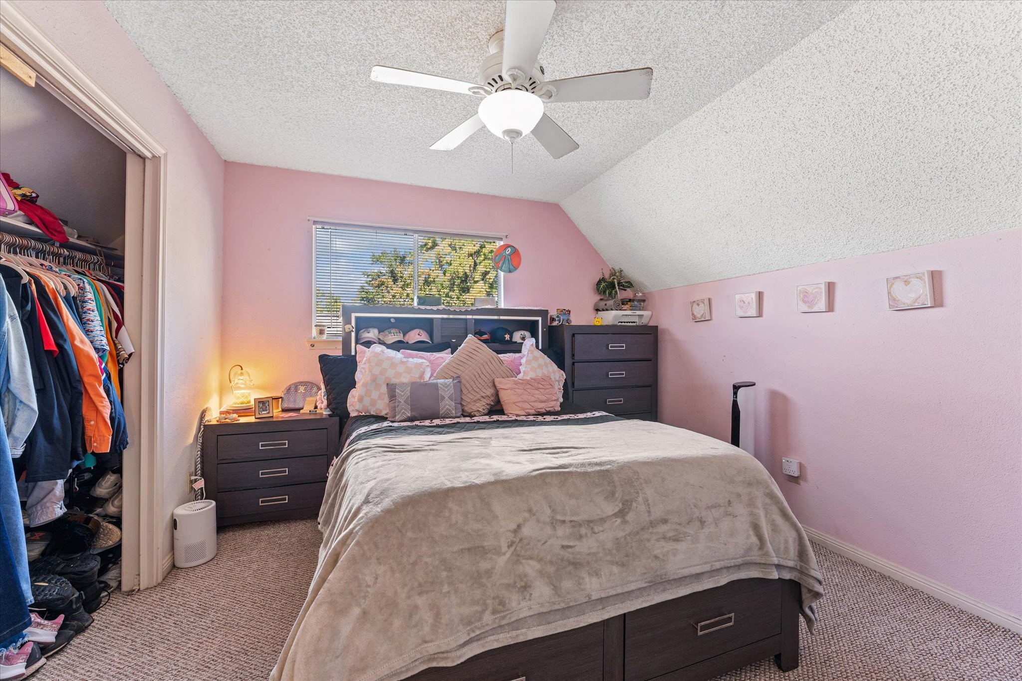 19527 Enchanted Spring Drive Spring, TX 77388 - Photo 18 of 33 a bedroom with a bed and a chandelier