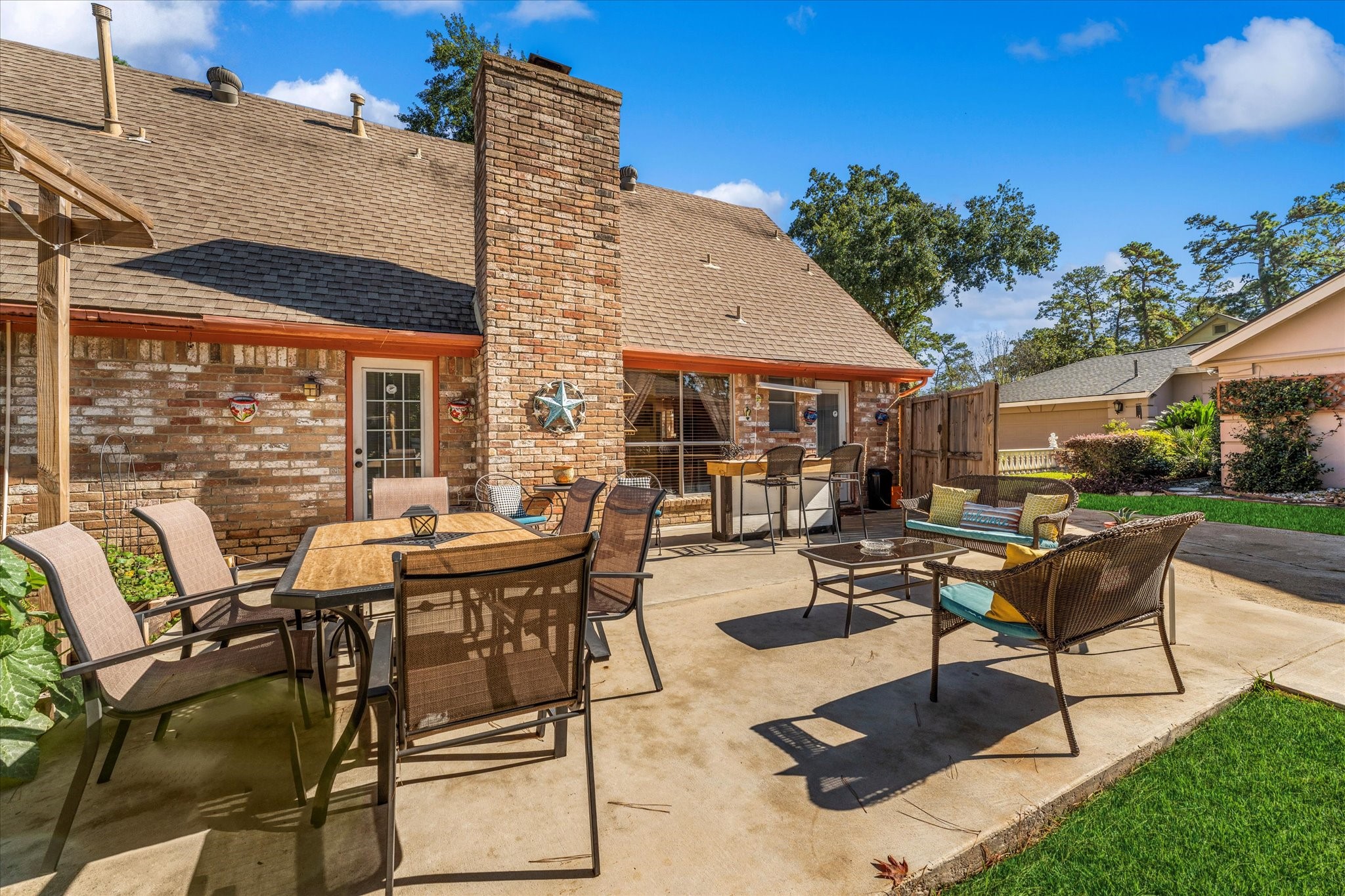 19527 Enchanted Spring Drive Spring, TX 77388 - Photo 27 of 33 a view of a patio with table and chairs and potted plants