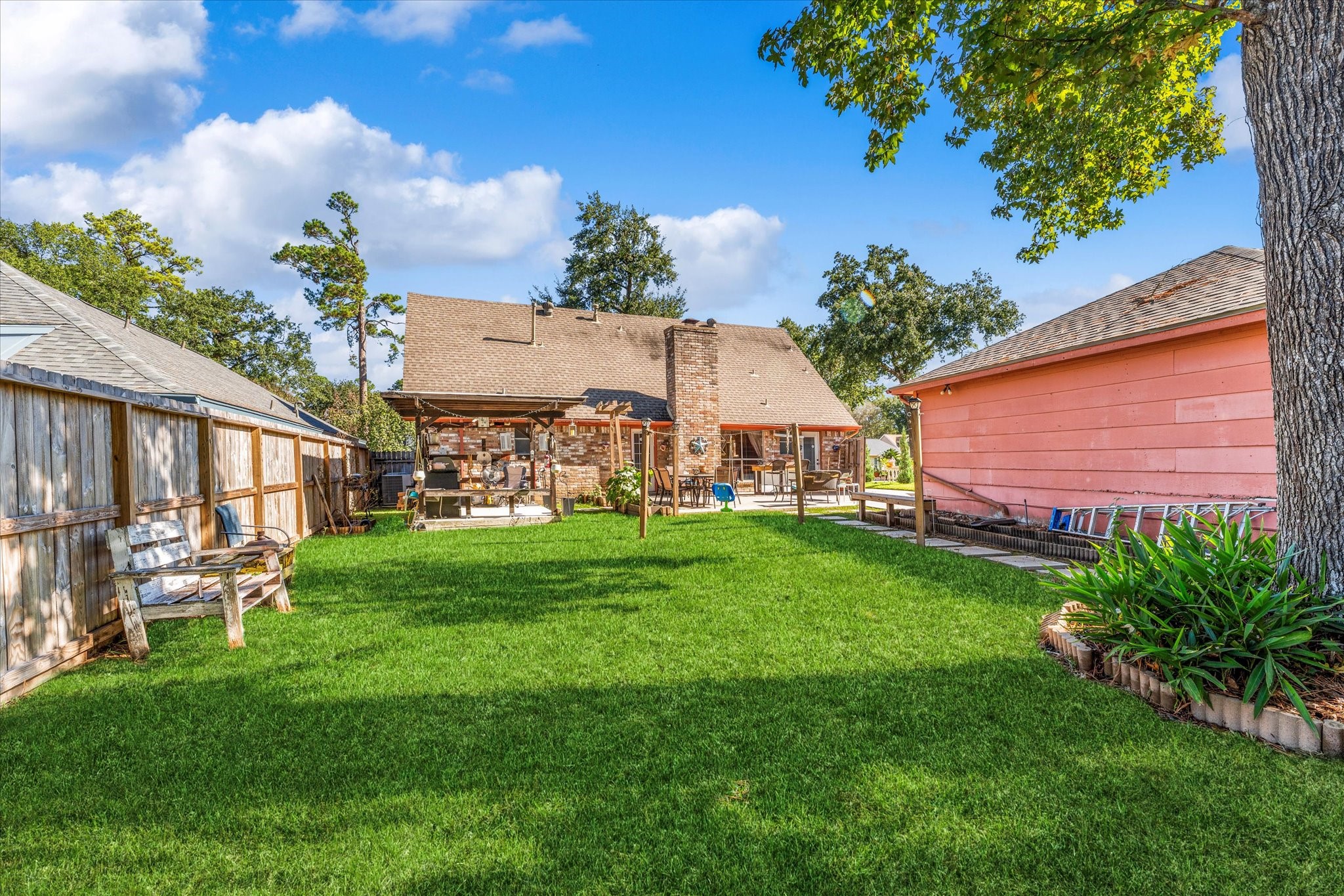 19527 Enchanted Spring Drive Spring, TX 77388 - Photo 28 of 33 a view of a patio with table and chairs and potted plants