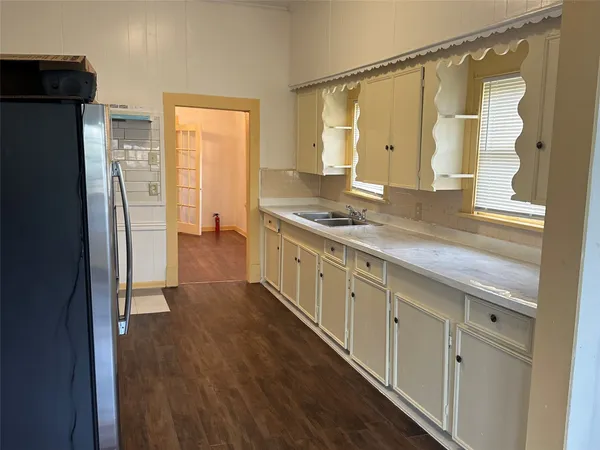a bathroom with a double vanity sink and mirror
