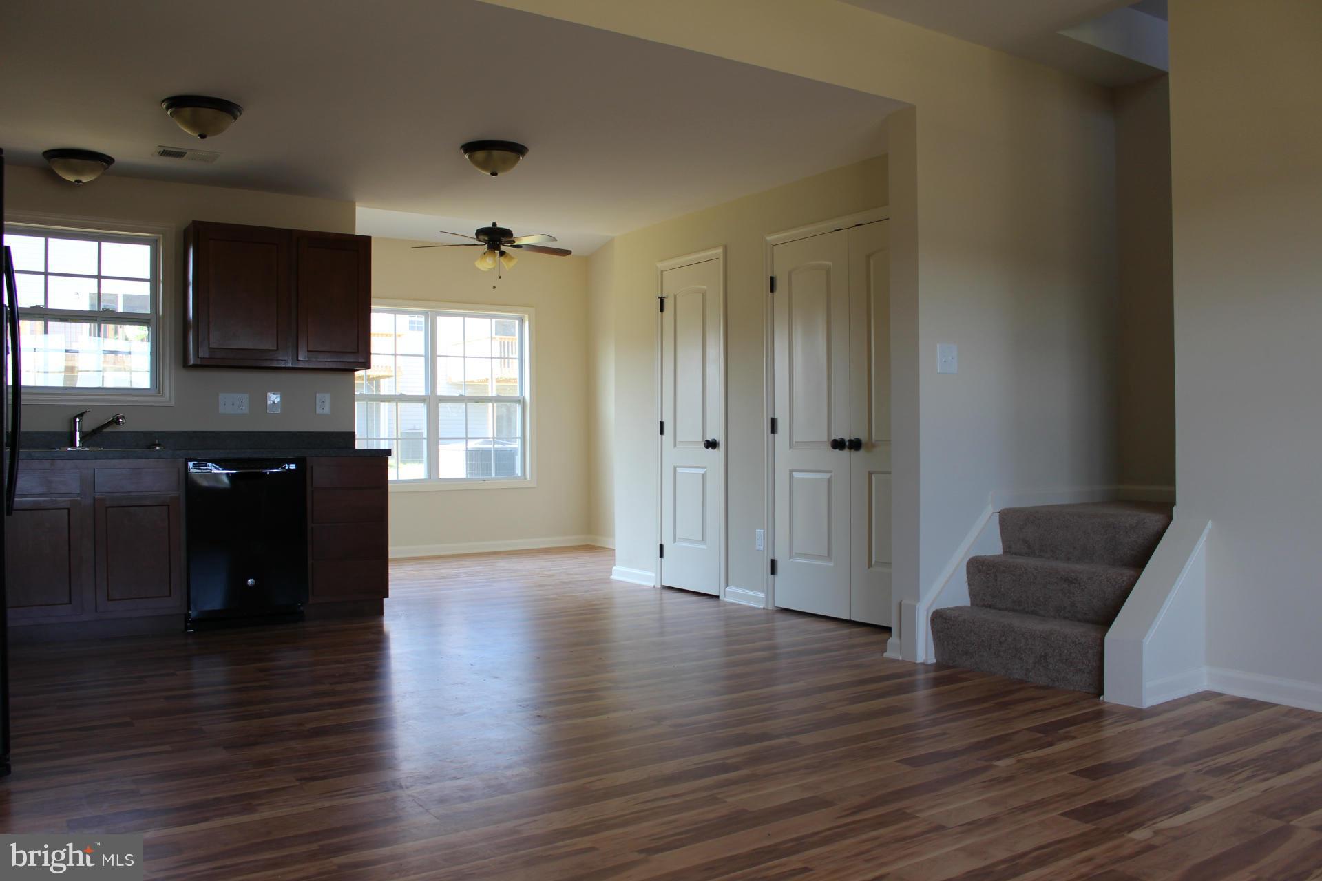34 Knowledge Court Inwood, WV 25428 - Photo 2 of 12 a view of a livingroom with furniture wooden floor and windows