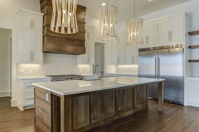 an empty room with wooden floor and a window