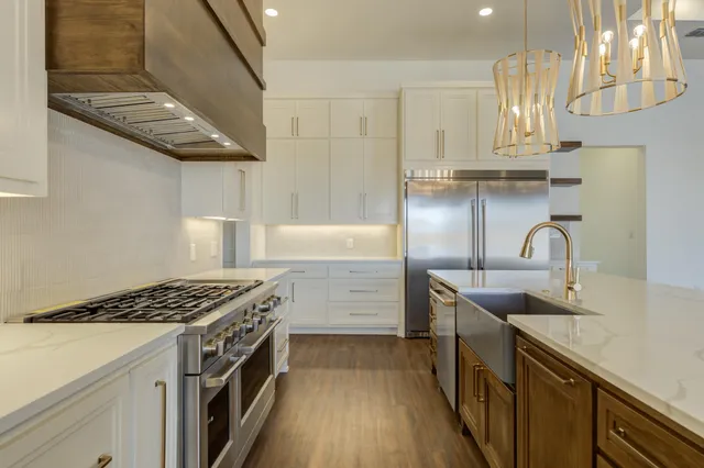 a spacious bathroom with a bathtub a sink and a mirror