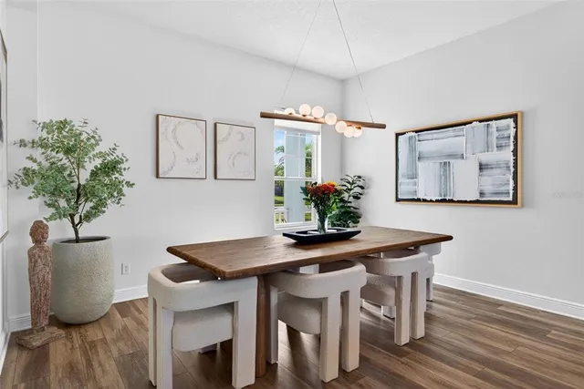 a view of a dining room with furniture window and outside view