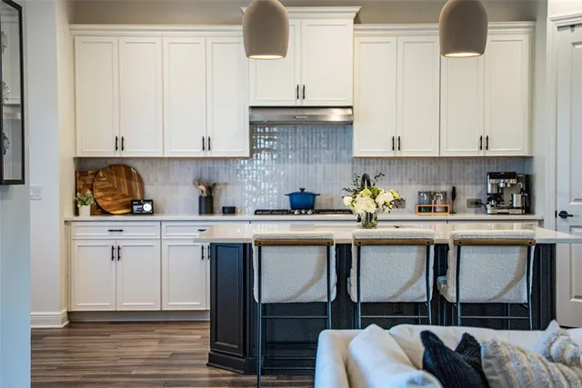 an aerial view of a residential houses with outdoor space and river