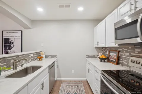 a kitchen with a stove and a microwave