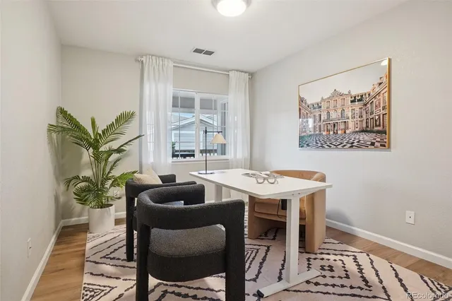a view of a dining room with furniture window and wooden floor