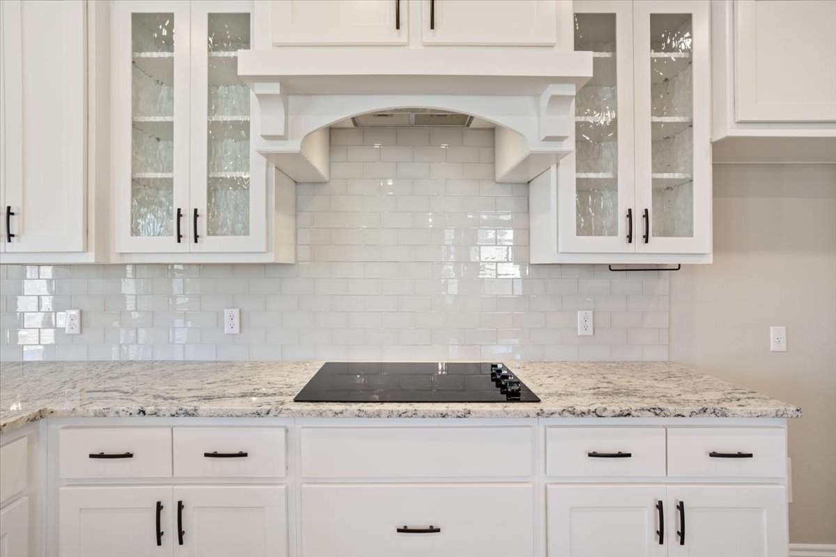 1701 Meadow Crest Salado, TX 76571 - Photo 12 of 30 a kitchen with a stove and cabinets