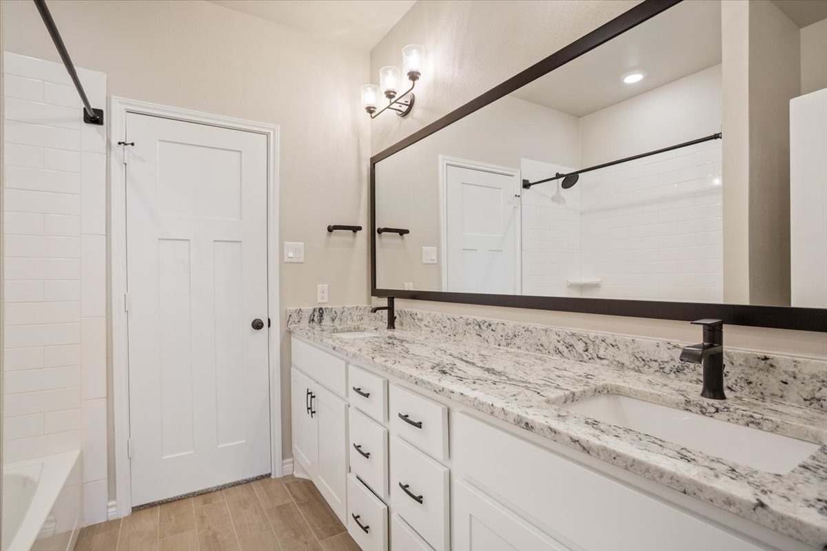 1701 Meadow Crest Salado, TX 76571 - Photo 21 of 30 a bathroom with a sink and a mirror
