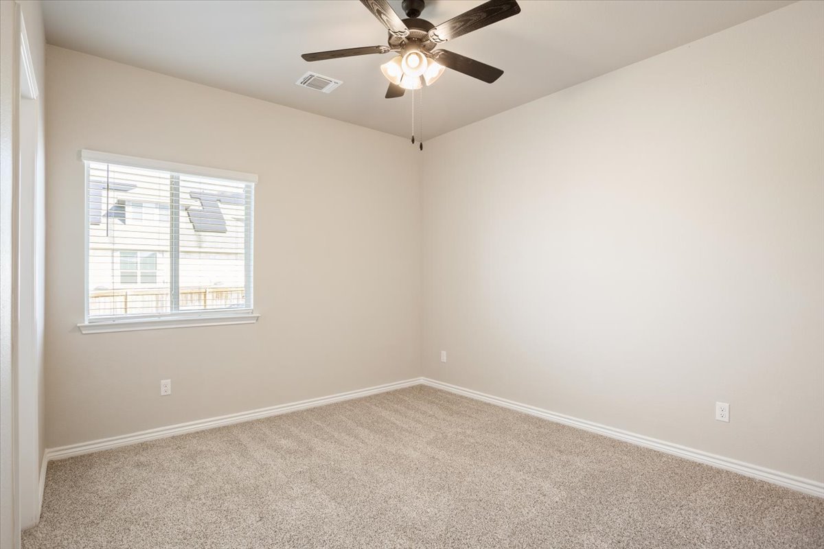 1701 Meadow Crest Salado, TX 76571 - Photo 22 of 30 an empty room with a window and a fan