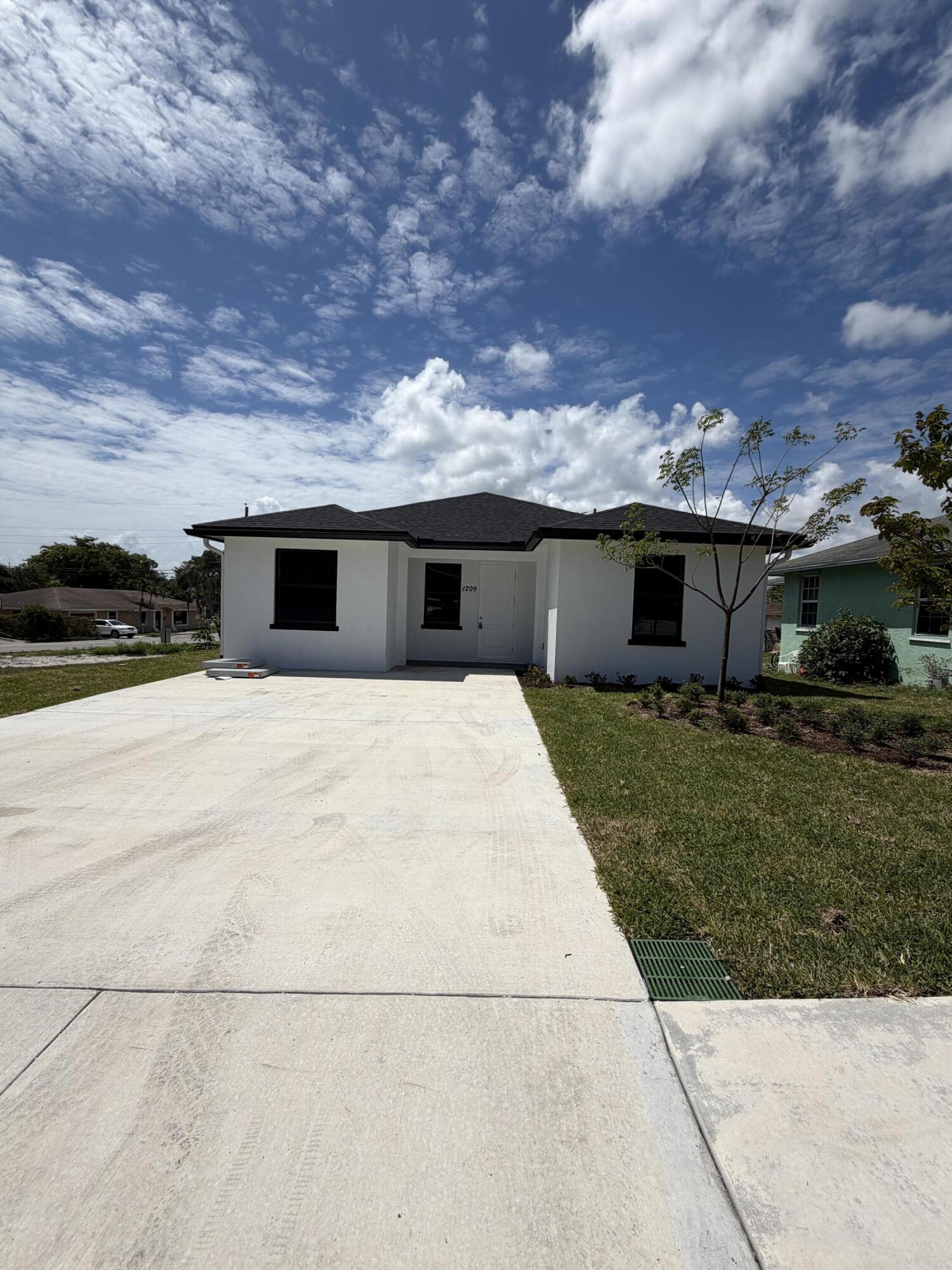 1209 West 33rd Street Riviera Beach, FL 33404 - Photo 1 of 20 1029 W 33rd St
