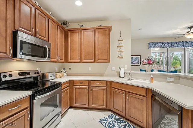 a kitchen with a sink stove and microwave
