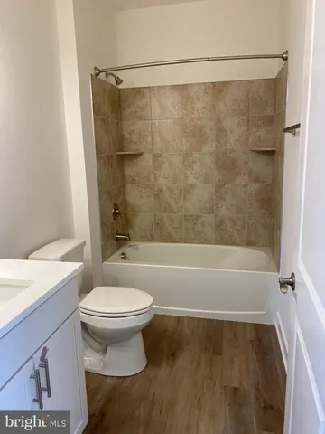 a bathroom with a shower and a toilet