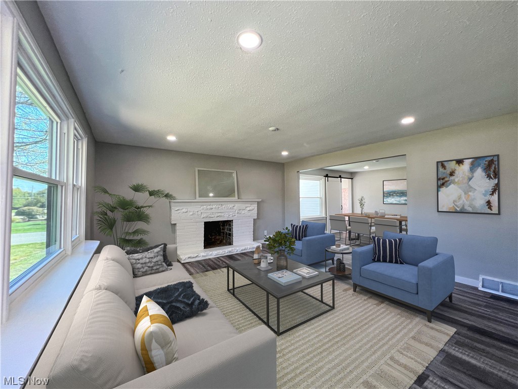602 West Marshall Road McDonald, OH 44437 - Photo 2 of 19 Staged -LVP floored living room featuring a textured ceiling