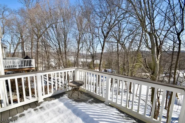 a view of a wooden fence and trees