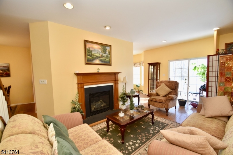 263 Ridge Drive Pompton Lakes, NJ 07442 - Photo 2 of 20 a living room with furniture and a fireplace