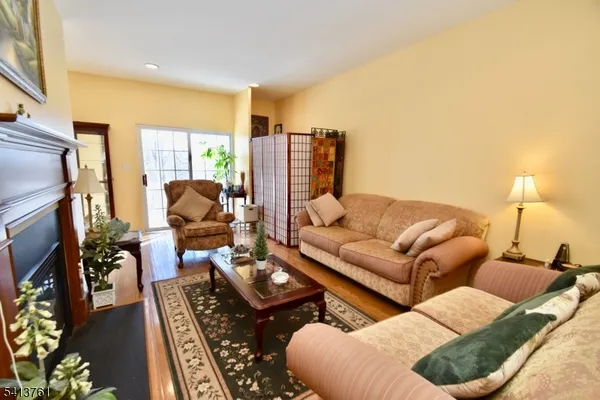 a living room with furniture fireplace and a flat screen tv