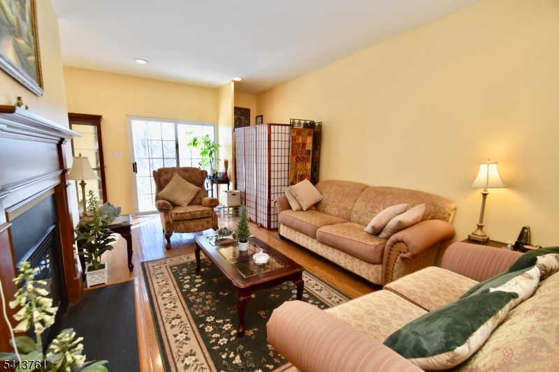263 Ridge Drive Pompton Lakes, NJ 07442 - Photo 3 of 20 a living room with furniture fireplace and a flat screen tv