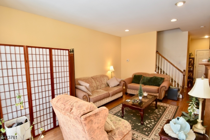 263 Ridge Drive Pompton Lakes, NJ 07442 - Photo 4 of 20 a living room with furniture and a floor to ceiling window