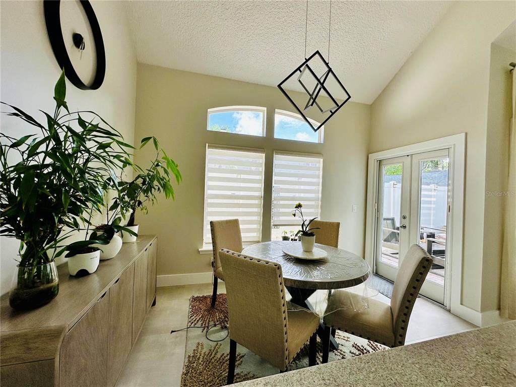 784 South Pennsylvania Avenue Winter Park, FL 32789 - Photo 14 of 29 a view of a dining room with furniture window and wooden floor